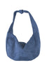 The Katydid Blue Suede Evening Tote is a roomy, slouchy bag with a rounded shape, knotted strap, and top zipper closure.