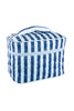 The Katydid Light Blue and Navy Striped Makeup Travel Bag features quilted fabric, blue and white stripes, a zipper closure, and a top handle—perfect for travel. Shown against a white background.