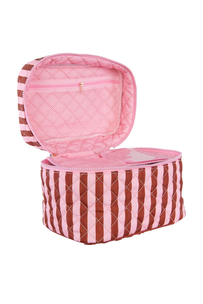 The Katydid Pink and Wine Striped Quilted Makeup Bag features vertical stripes, a pink interior, and a mesh zip pocket—ideal as a travel pouch for organizing your beauty essentials.