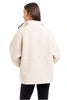 A woman with long brown hair, seen from behind, wears the Katydid Cream Womens Sherpa Lace Trim Jacket and black leggings against a plain white background.