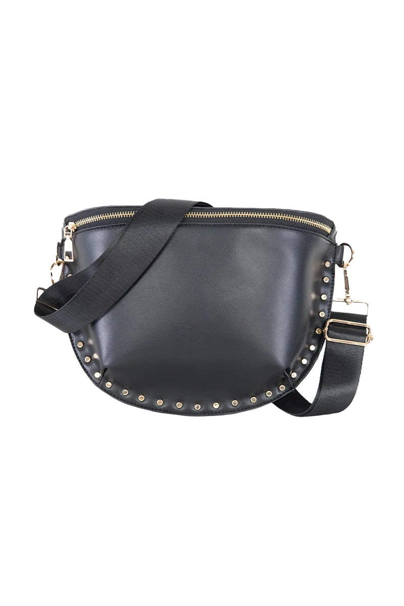 The Katydid Black Gold-Studded Crossbody Bag features a chic half-moon shape, gold stud detailing along the bottom, a gold zipper, and an adjustable black strap with gold hardware.
