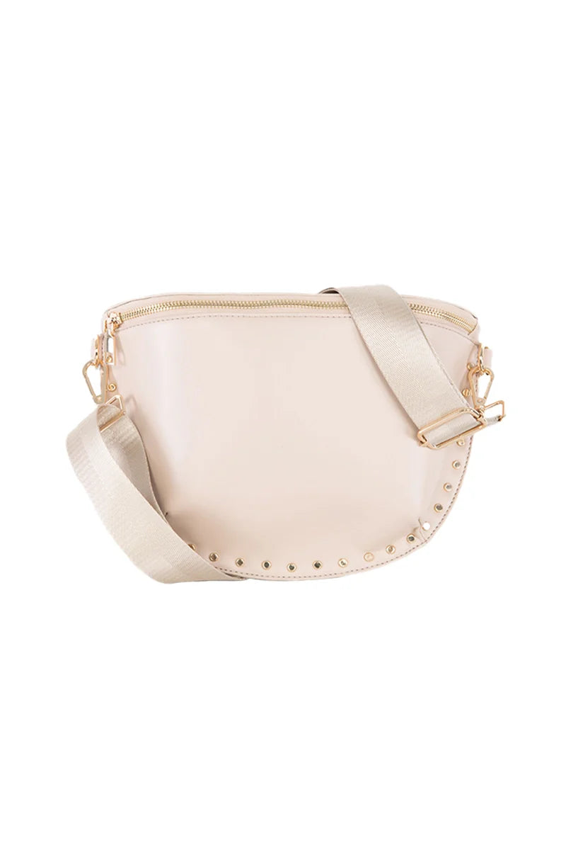 The Katydid Tan Gold-Studded Structured Crossbody features a chic beige style, wide fabric strap, gold hardware, and small gold studs on the curved bottom edge—making it the perfect neutral crossbody bag for fall.