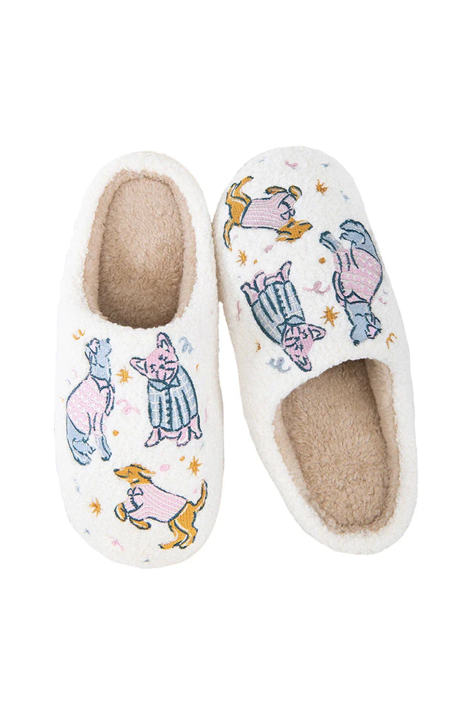 The Posh Pets Women Slippers by Katydid feature white fuzzy sherpa, a tan lining, and colorful cartoon dogs in hats and coats—adorable cat and dog slippers perfect for pet lovers.