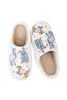 The Posh Pets Women Slippers by Katydid feature white fuzzy sherpa, a tan lining, and colorful cartoon dogs in hats and coats—adorable cat and dog slippers perfect for pet lovers.