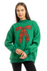 A woman smiles against a white background wearing the Katydid Red Plaid Bow Mockneck Sweatshirt for women, creating a cozy holiday outfit.