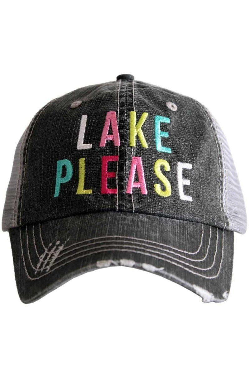 A black and white distressed trucker hat with the words lake please on it