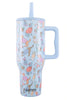 The Katydid Posh Pets Party Easy Carry Flip Top Tumbler is a light blue reusable cup with a large handle, straw, and playful dog illustrations in colorful outfits.