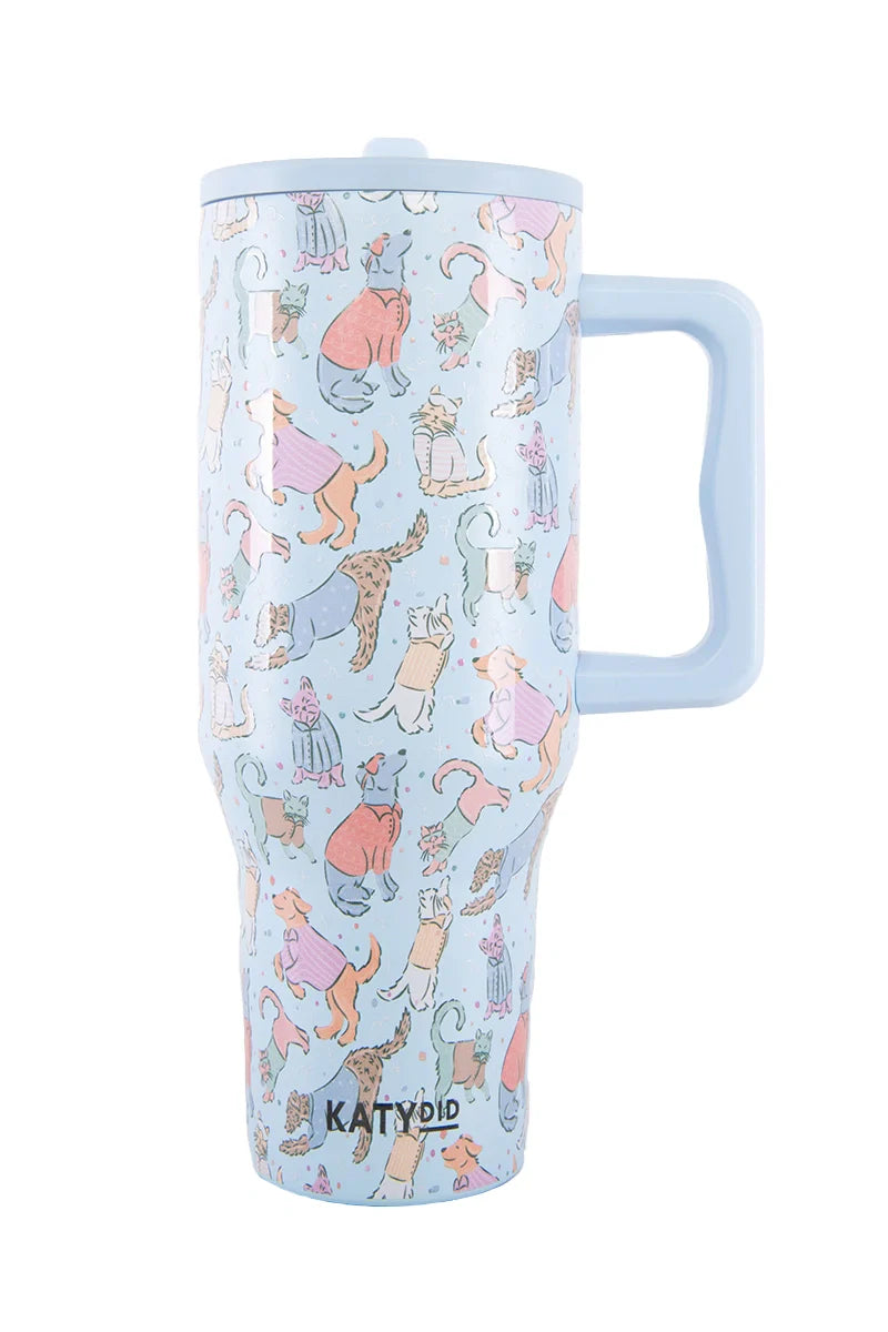 The Posh Pets Party Easy Carry Flip Top Tumbler by Katydid is a light blue reusable cup with handle, featuring playful cats in fun outfits. KATYDID is printed near the base—perfect for animal lovers.