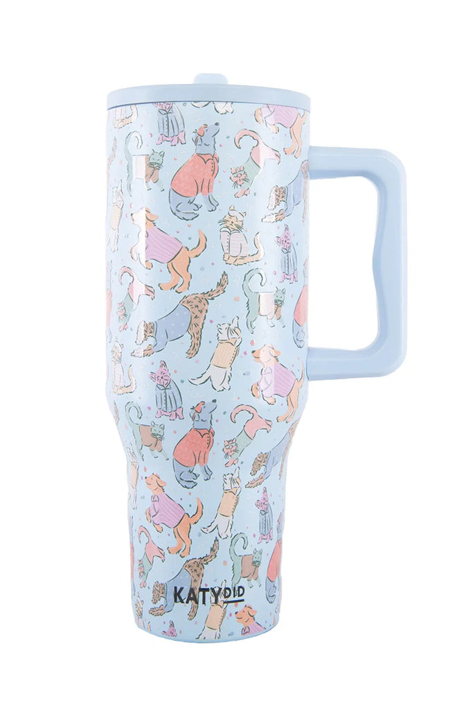 The Posh Pets Party Easy Carry Flip Top Tumbler by Katydid is a light blue reusable cup with handle, featuring playful cats in fun outfits. KATYDID is printed near the base—perfect for animal lovers.