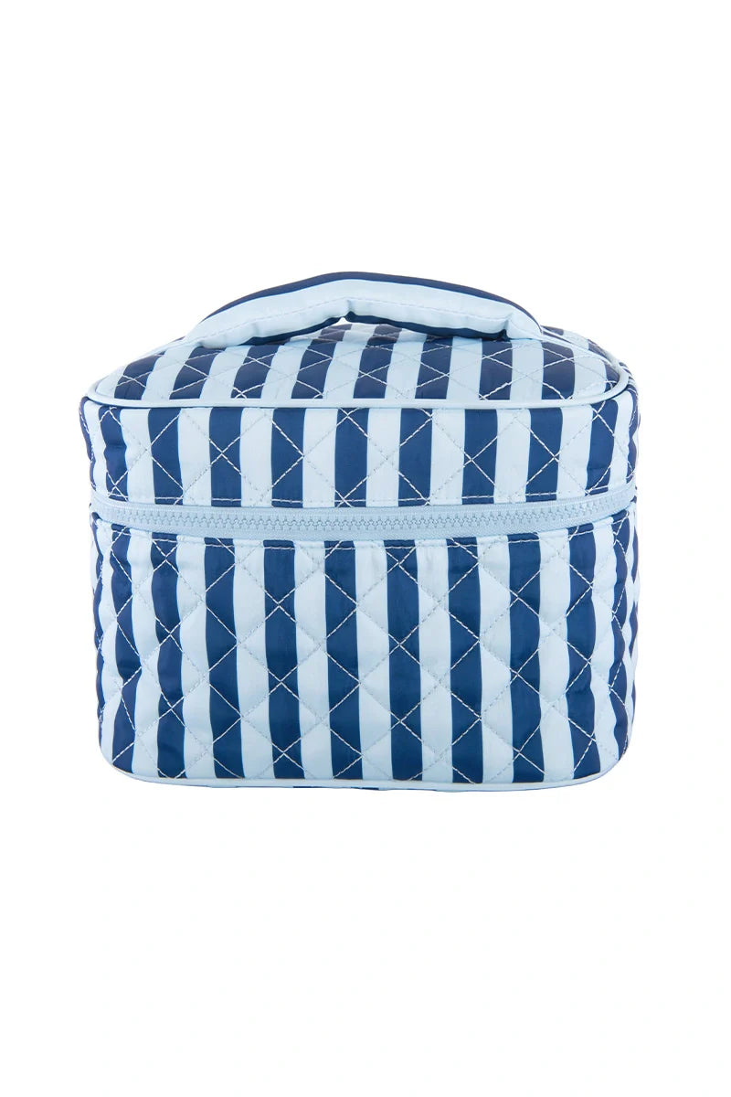 The Katydid Light Blue and Navy Striped Makeup Travel Bag is a quilted rectangular pouch with a top handle and chic vertical stripes—ideal for travel or daily use.