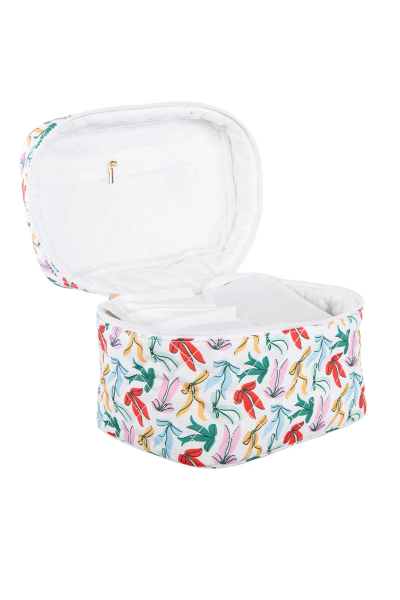 The Katydid Whimsical Bows Cute Makeup Bag features a white zippered case with a playful bow pattern, a white padded interior with compartments, and a small zip pocket—perfect for organizing accessories in style.