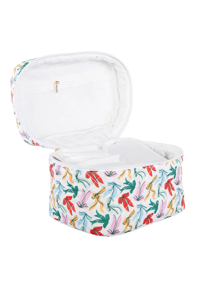 The Katydid Whimsical Bows Cute Makeup Bag features a white zippered case with a playful bow pattern, a white padded interior with compartments, and a small zip pocket—perfect for organizing accessories in style.