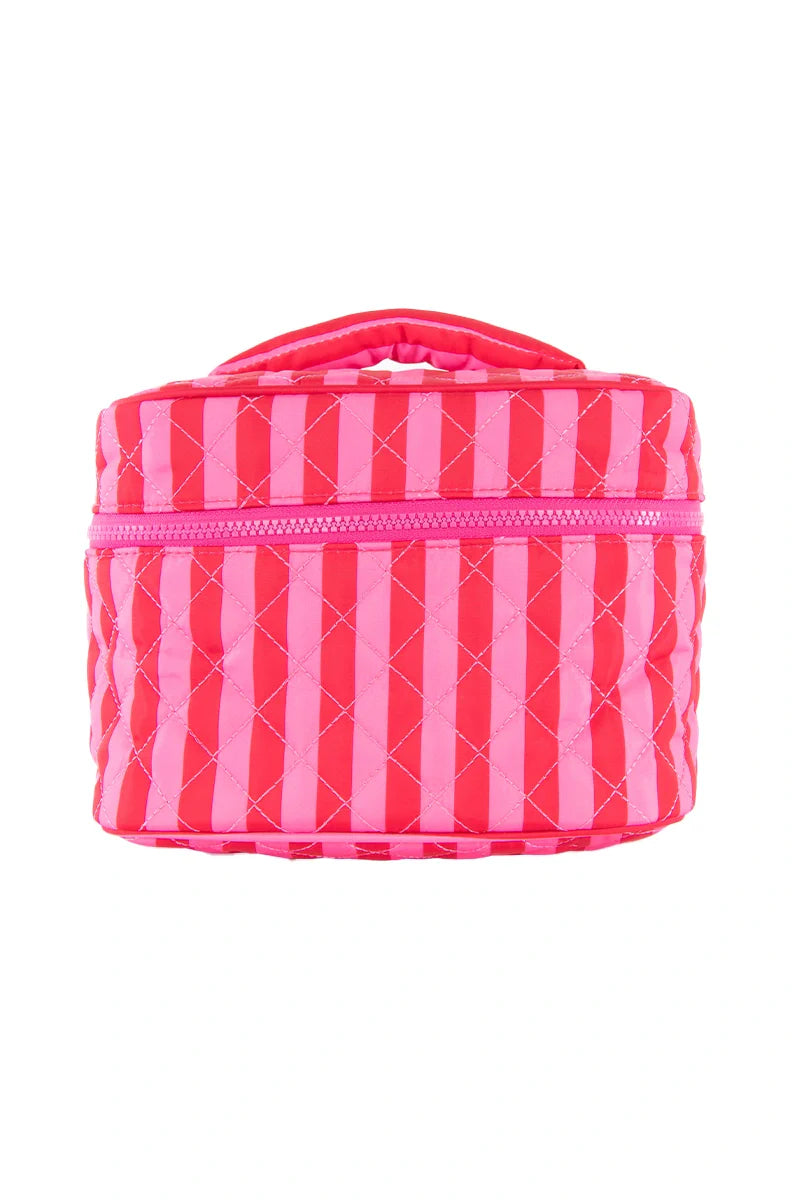 The Katydid Pink and Hot Pink Striped Make Up Bag is a small quilted bag with diagonal stripes, a top zipper, and handle—perfect as a travel cosmetic bag to carry all your essentials.