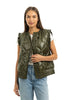 A woman wearing a white short-sleeve top, light blue jeans, and the Katydid Olive Metallic Puffer Lightweight Vest smiles against a white background.