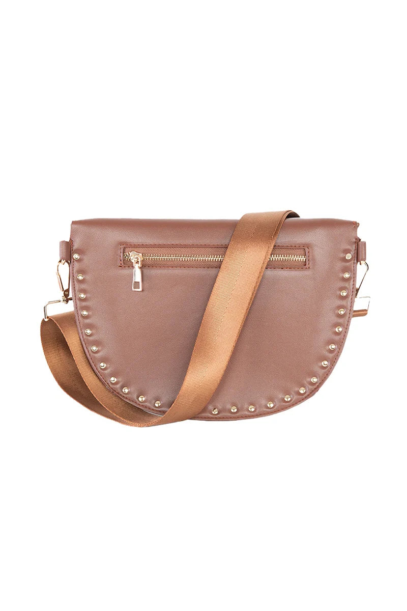 The Katydid Brown Gold-Studded Crossbody Sling Bag features gold-tone studs along the curved bottom, a gold zipper pocket on the front, and a wide matching strap—perfect for everyday use.