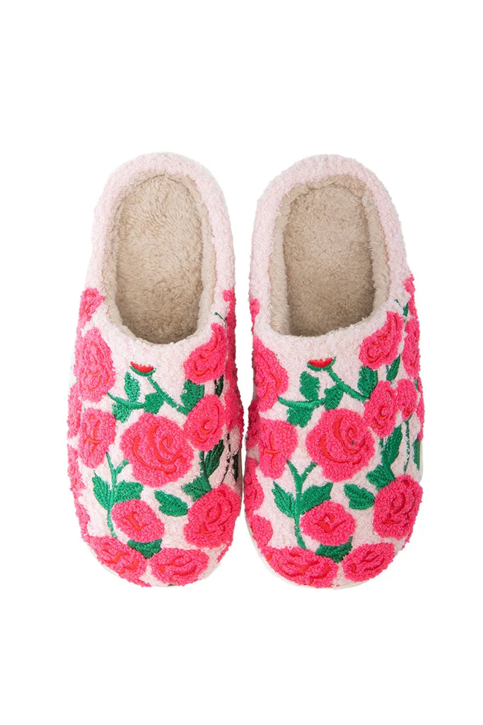 The Katydid Whimsical Roses Fuzzy Slippers for women are cozy, cream-colored sherpa slippers featuring soft texture and embroidered pink and red roses with green leaves.