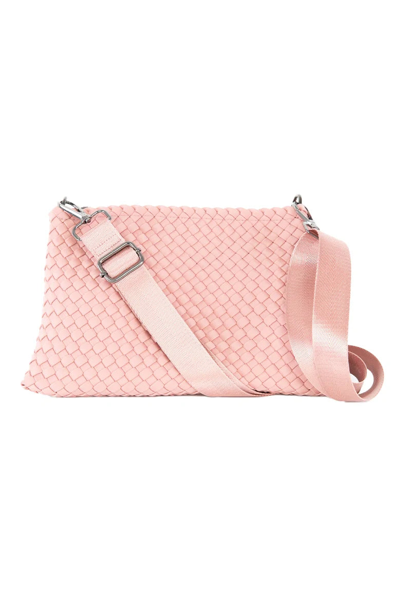 The Katydid Blush Woven Everywhere Crossbody Bag features a wide matching adjustable strap and silver hardware, shown against a white background.