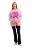 A woman smiles, wearing the Katydid Merry  Bright Plaid Mockneck Sweatshirt for women paired with black pants and white sneakers, set against a white background.