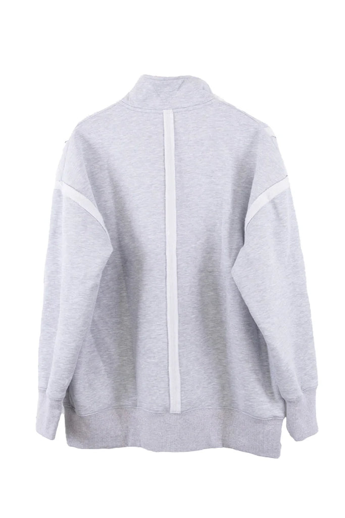 The Katydid Gray Vintage Wash Pullover Jacket features a high snap-neck collar, long sleeves, and white vertical and shoulder stripes for a modern yet classic look.
