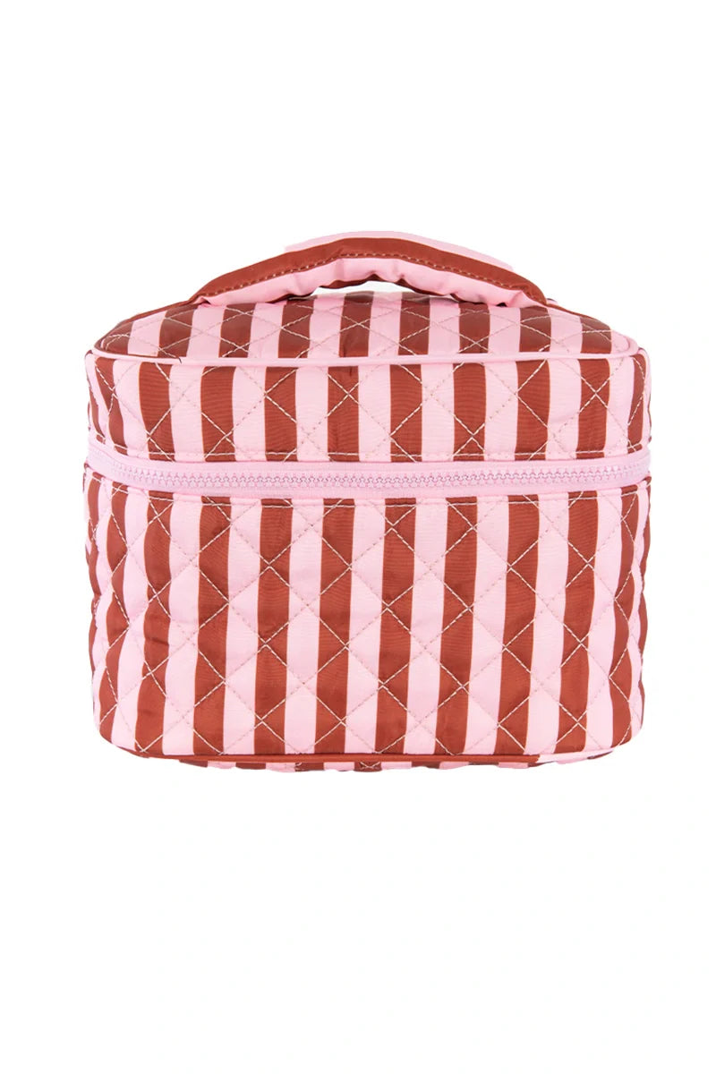 The Katydid Pink and Wine Striped Quilted Makeup Bag features vertical stripes, a top handle, and a front zipper—ideal as your travel makeup pouch.