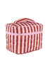 The Katydid Pink and Wine Striped Quilted Makeup Bag features diagonal pink and wine stripes, a handle, a rectangular shape, and a pink zipper around the top.