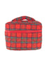 The Katydid Royal Stewart Plaid Holiday Travel Makeup Bag features quilted red and green plaid fabric, a top handle, and a zipper around the middle—perfect for festive makeup storage against a white backdrop.