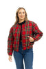 A person with long, light brown hair wears the Katydid Royal Stewart Plaid Holiday Quilted Jacket over a black top and blue jeans, standing with one hand in their pocket against a white background.