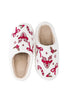 Katydid’s Bow Reindeer Winter Slippers feature a cozy beige sherpa lining and festive red and green embroidery—reindeer faces, holly, candy canes, and bows—making them the perfect Christmas slippers.