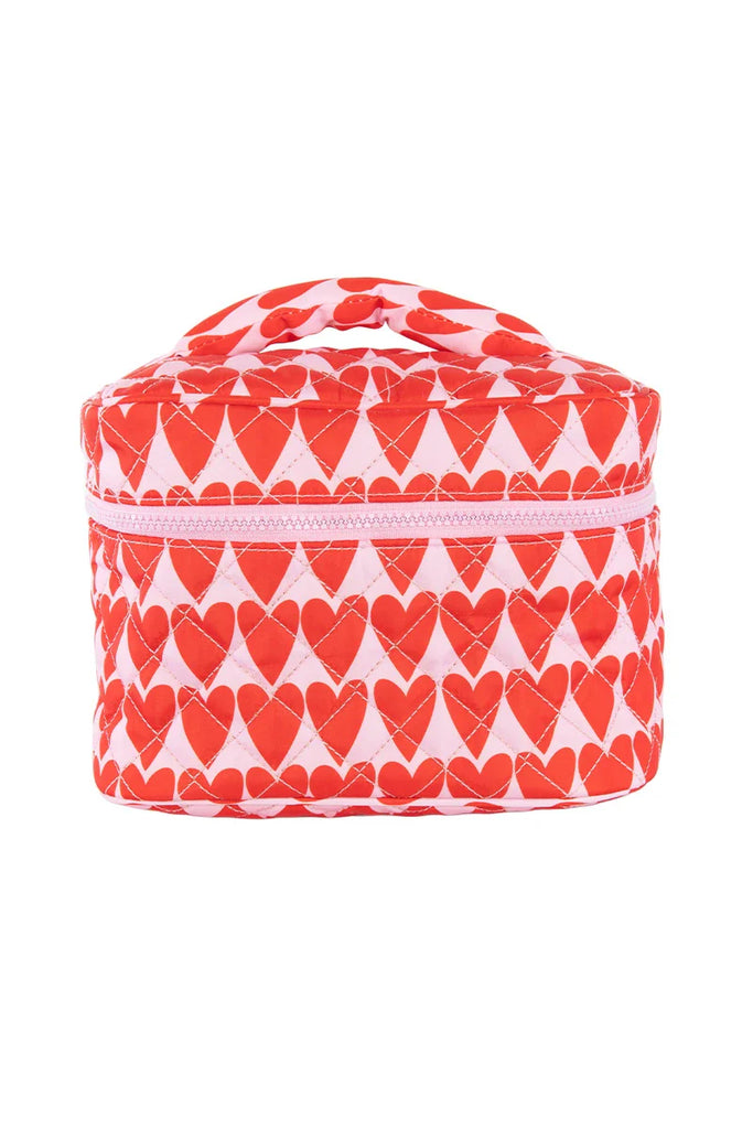 The Katydid Girly Red Hearts Makeup Bag is a soft, rectangular zippered pouch with a handle, featuring a cute red heart pattern on white—perfect for storing your beauty essentials.