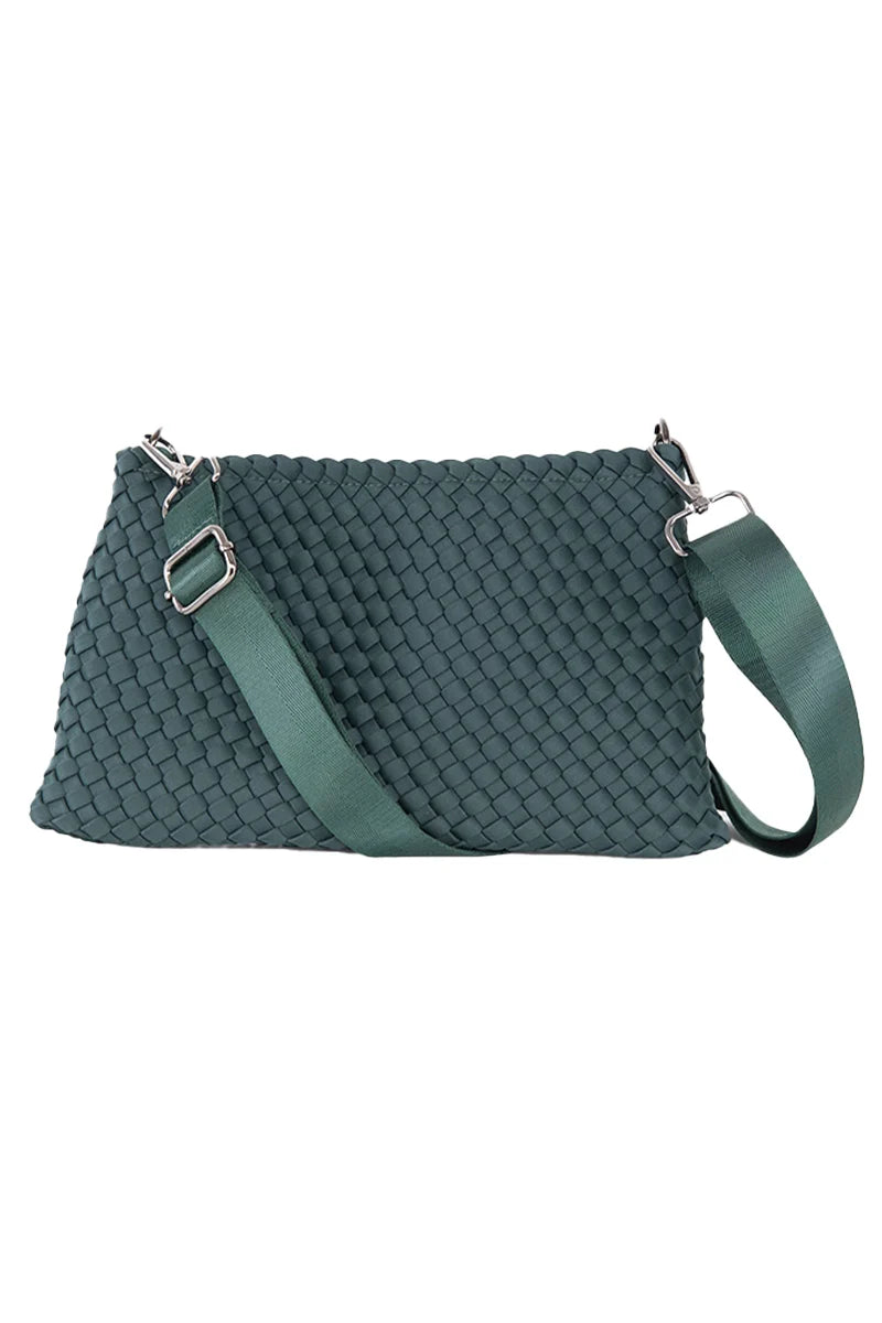 The Katydid Forest Green Woven Everywhere Crossbody features a woven texture, wide adjustable strap, and silver hardware—perfect for hands-free daily adventures.