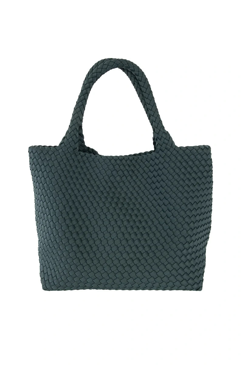 The Katydid Forest Green Woven Tote Bag, featuring two sturdy handles, is shown against a white background—a perfect large handbag for fall.