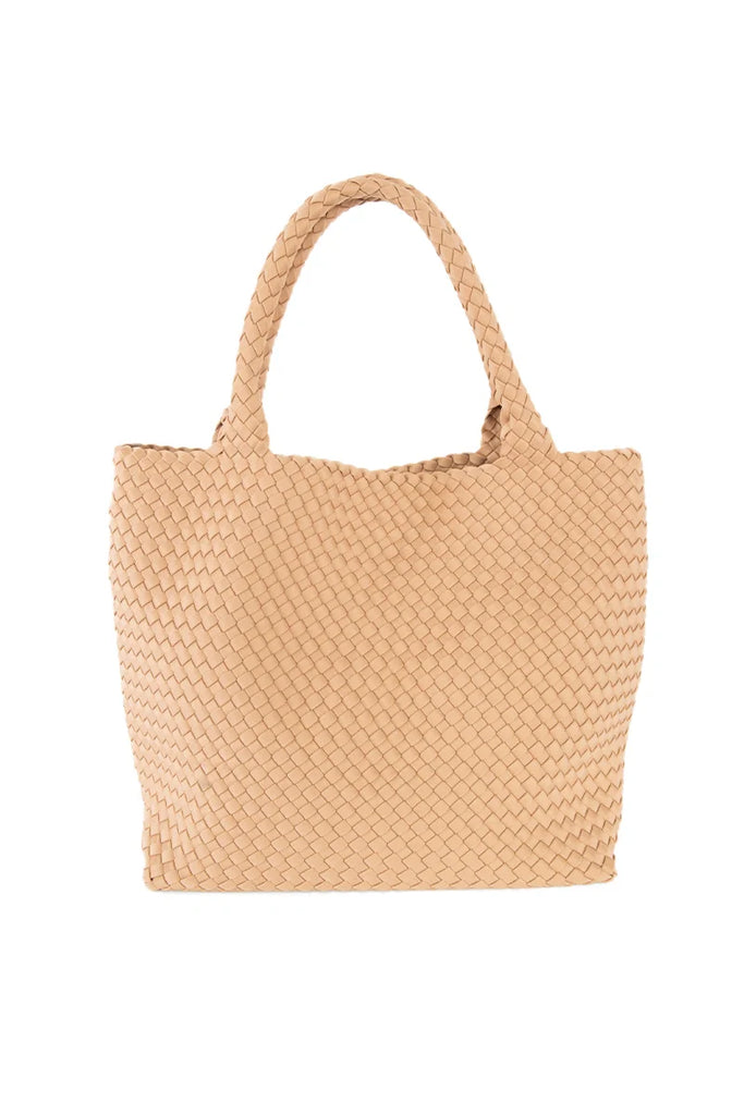 The Katydid Camel Woven Tote Bag features two handles, a spacious rectangular shape, and a textured basket-weave design—perfect for carrying your everyday essentials in style.