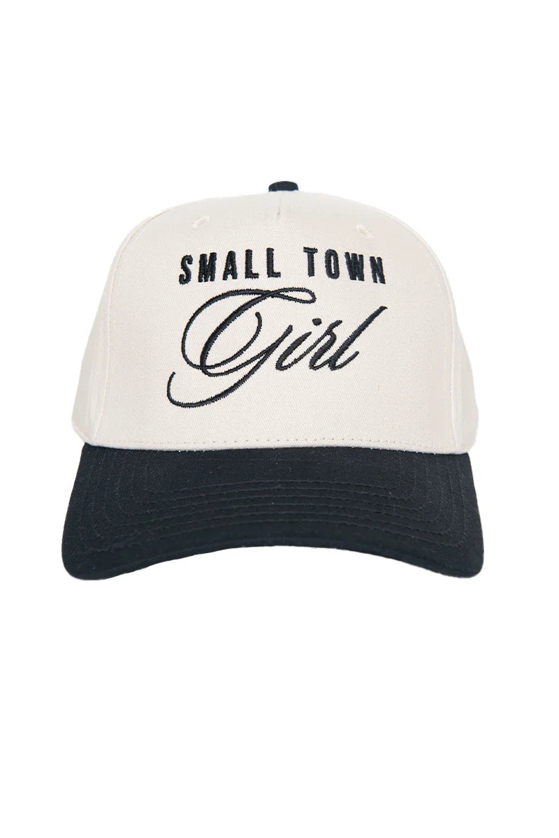 The Katydid Small Town Girl Vintage Trucker Hat for Women features SMALL TOWN Girl embroidered in black, with Girl in cursive on a stylish white and black cap—perfect for expressing your hometown pride.
