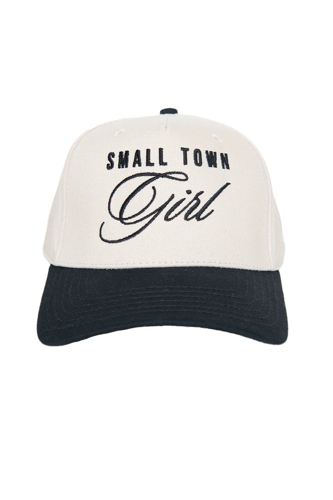 The Katydid Small Town Girl Vintage Trucker Hat for Women features SMALL TOWN Girl embroidered in black, with Girl in cursive on a stylish white and black cap—perfect for expressing your hometown pride.