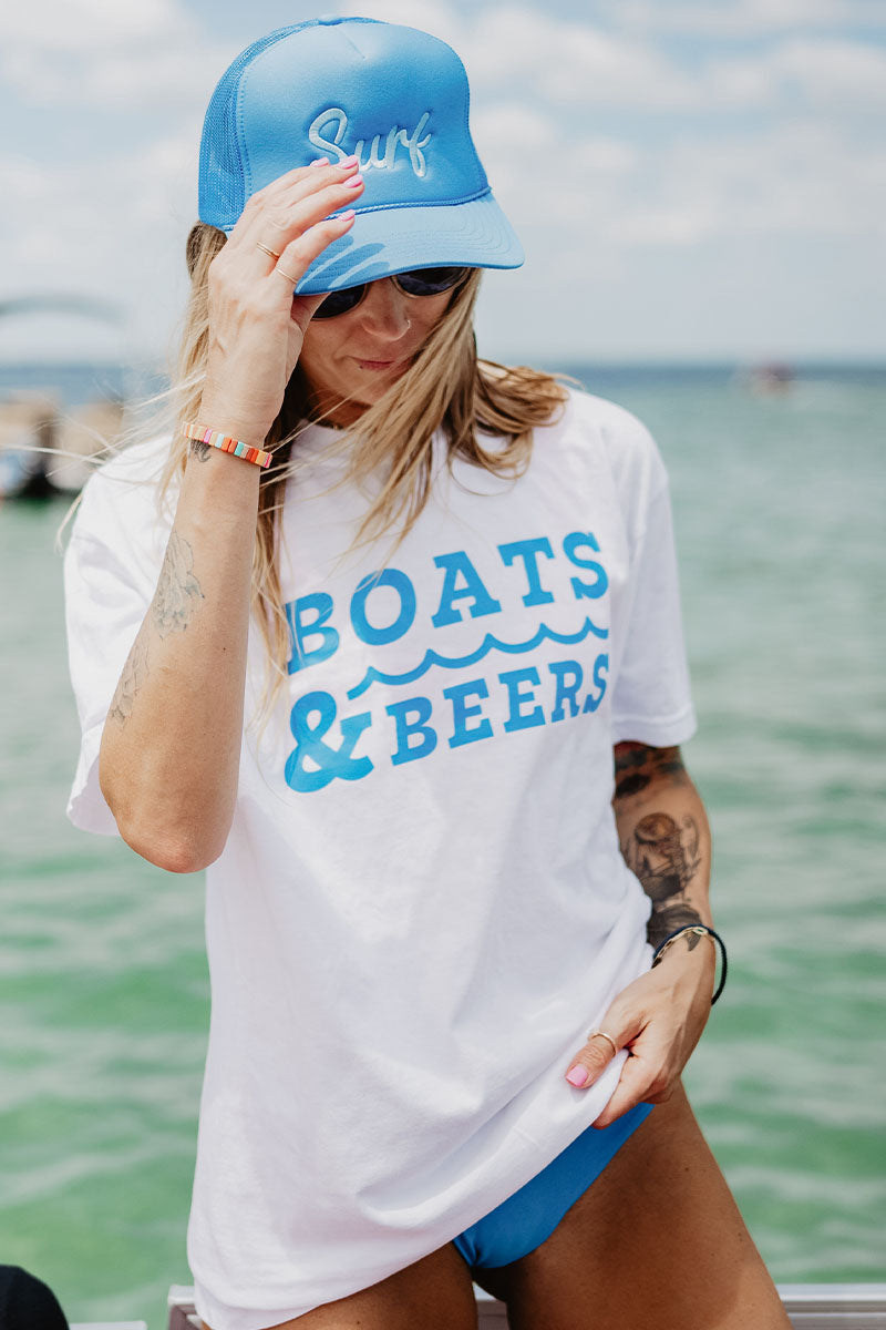 woman at a dock wearing boats and beers wave tshirt