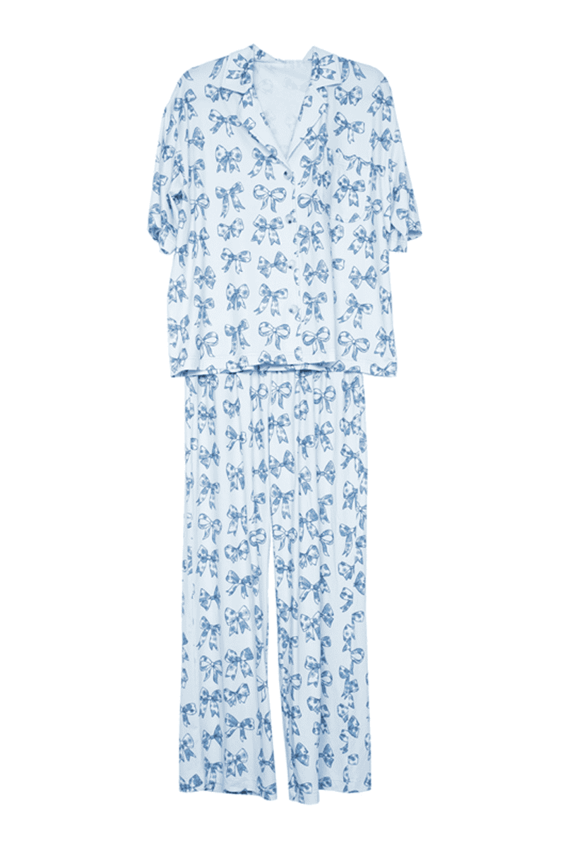 The Katydid Light Blue Toile Coquette Bows Lounge Pants Set features a short-sleeve button-up top and long pants with an all-over blue bow print—perfect adorable pajamas for a stylish, relaxed look.