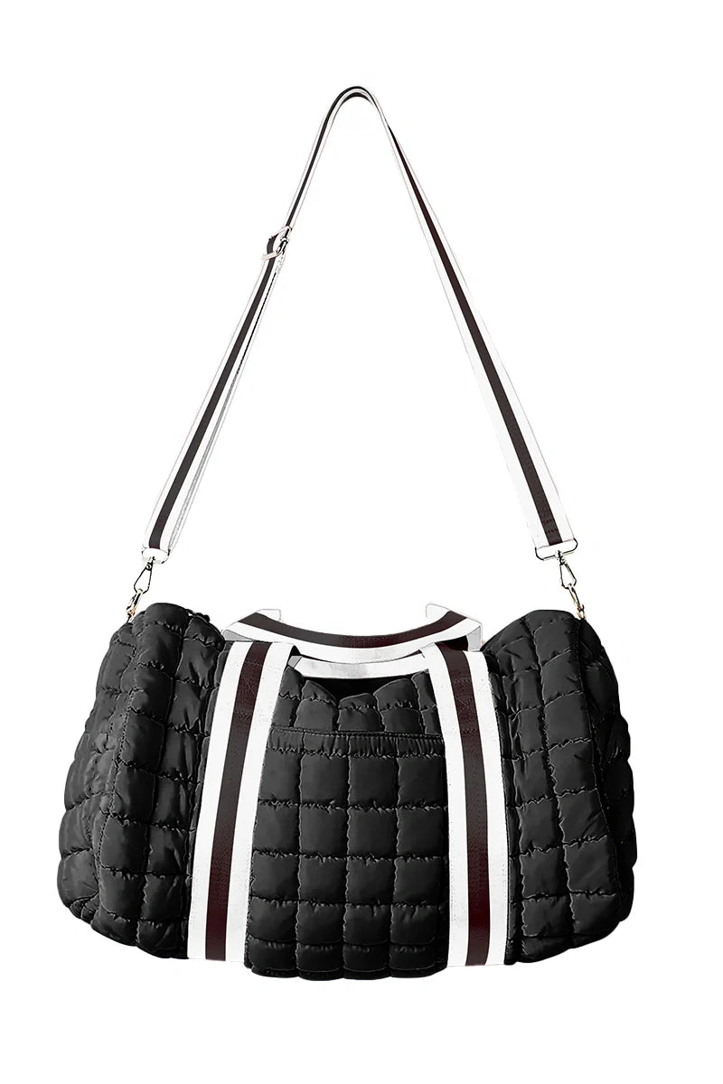 The Katydid Black Striped Garment Duffel Bag features white and black striped handles, an adjustable shoulder strap, and is ideal for travel or gym use. Displayed against a white background.