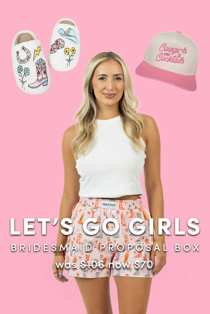 A woman in a white tank top and patterned shorts stands before a pink backdrop with illustrated slippers and a cap above her. Text reads: Lets Go Girls | Bridesmaid Proposal Box by Katydid.com—was 106, now 70.
