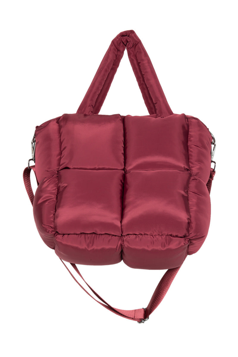 A maroon quilted handbag with padded handles and a detachable crossbody strap is displayed on a white background—ideal for pairing with fun accessories or cozy slippers from the Katydid.com Build Your Own Katydid Set 10 Items for 60, a 350 value.