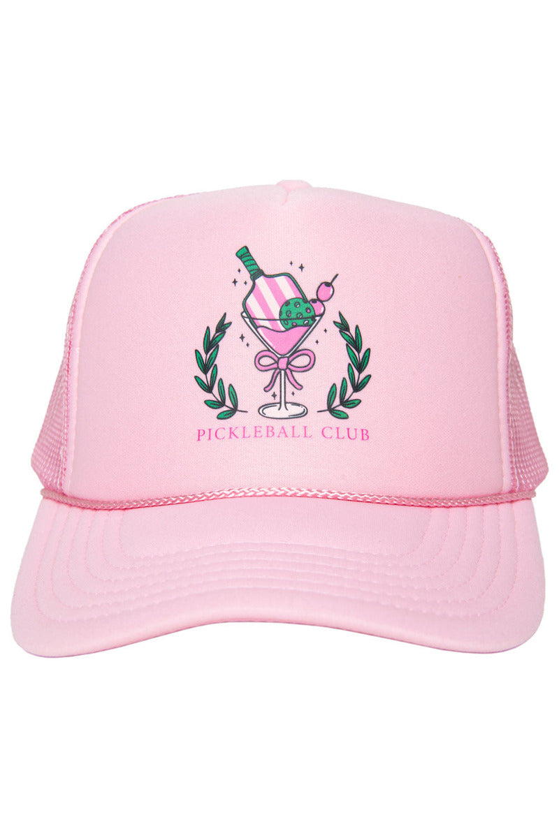 The Katydid Pickleball Club Martini Foam Trucker Hat is pink, with a paddle, ball, and bottle above a martini glass with laurel branches. Bold “PICKLEBALL CLUB” text appears below the playful design.
