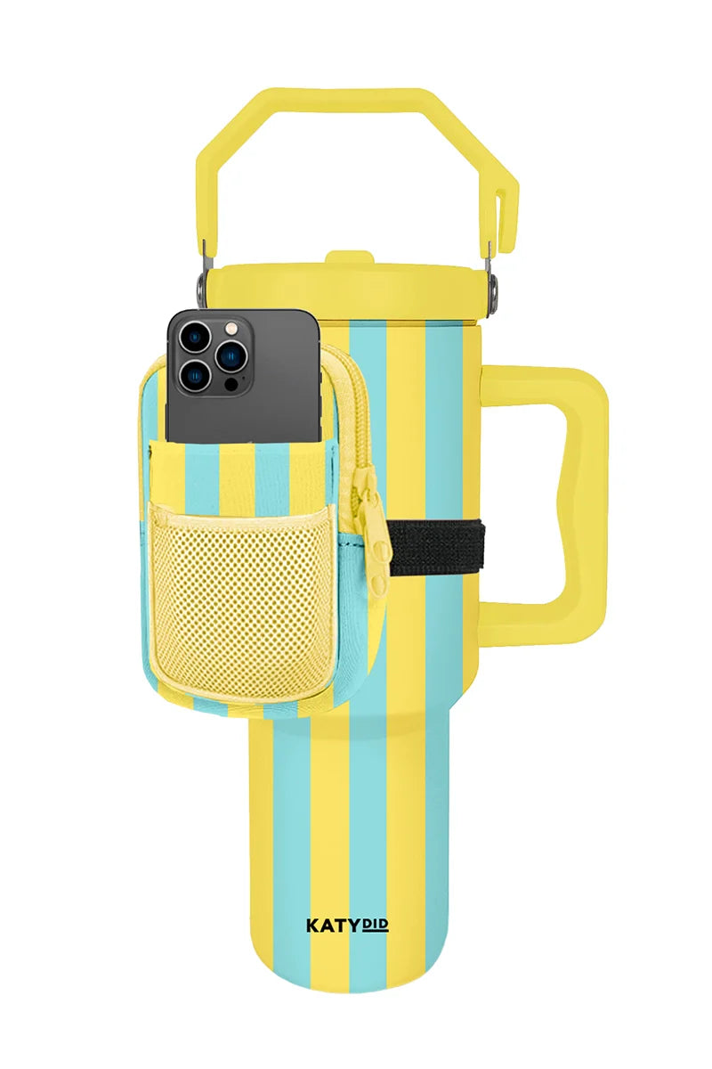 The Katydid Yellow and Aqua Striped Tumbler features a yellow handle and lid, plus a matching striped zipper pouch with a mesh smartphone pocket, both branded with Katydid.