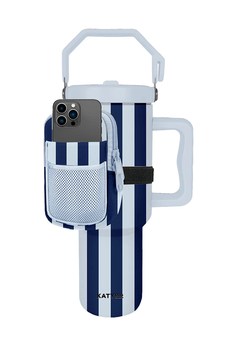 The Katydid Light Blue and Navy Striped Velcro Bag for Tumbler is a stylish pouch that attaches to your tumbler, holds your smartphone, and features a handy mesh pocket on the front.