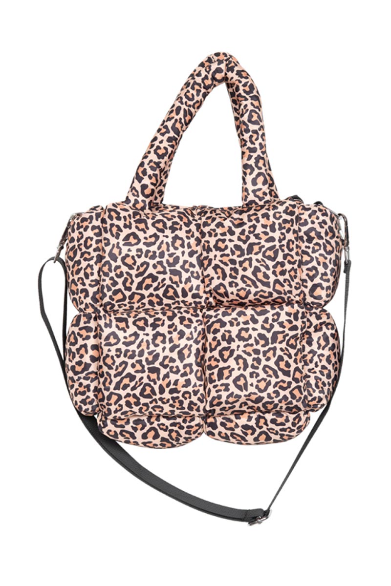The Katydid Brown Leopard Mini Puffer Tote Bag features a stylish beige and black leopard print, two short handles, and a long adjustable black strap, making it both fashionable and functional.