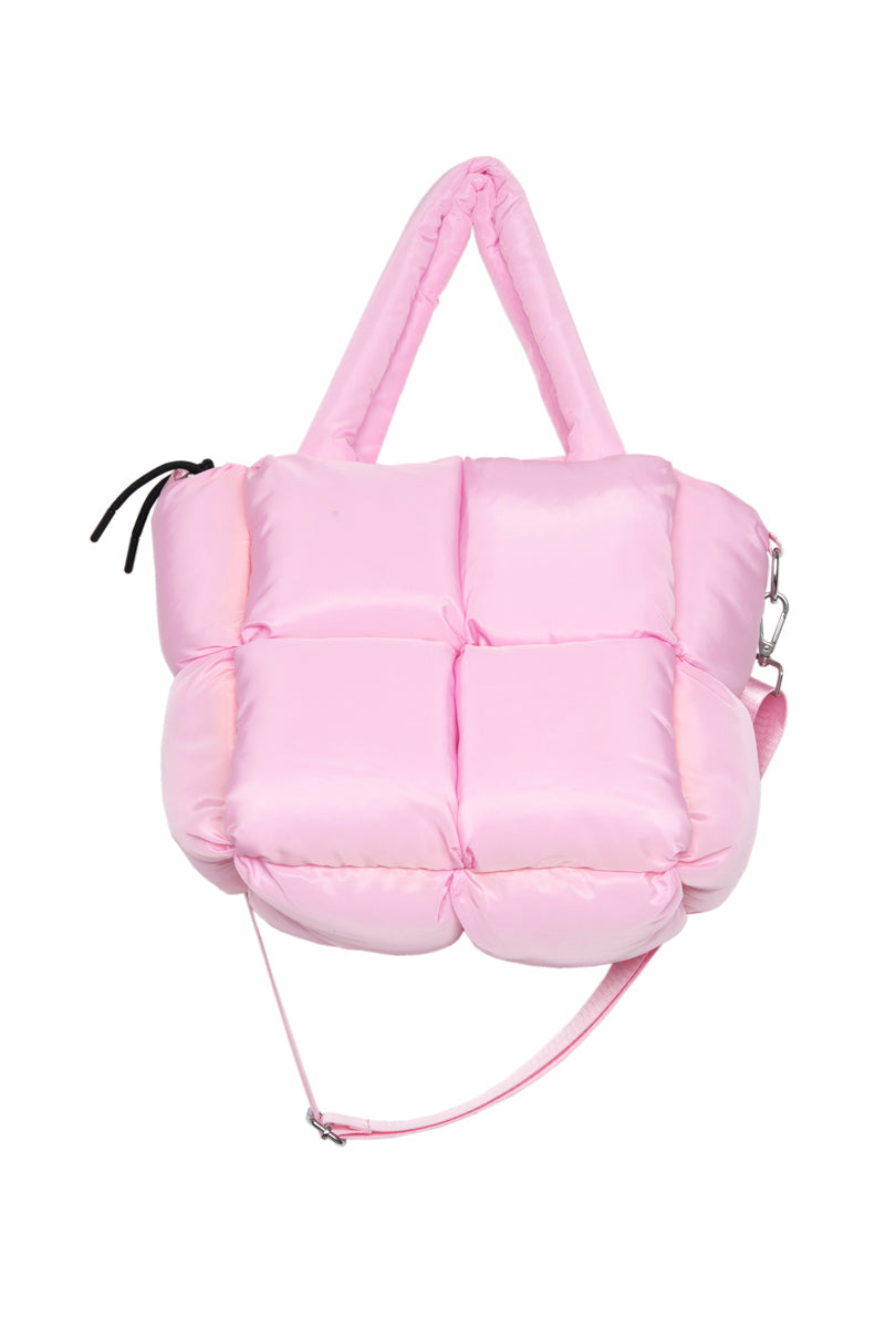 A soft, puffy pink handbag featuring square quilting, dual handles, a detachable shoulder strap, and a small black zipper pull on the top left—an adorable accessory to include in your Build Your Own Katydid Set 10 Items for 60, a 350 value from Katydid.com.