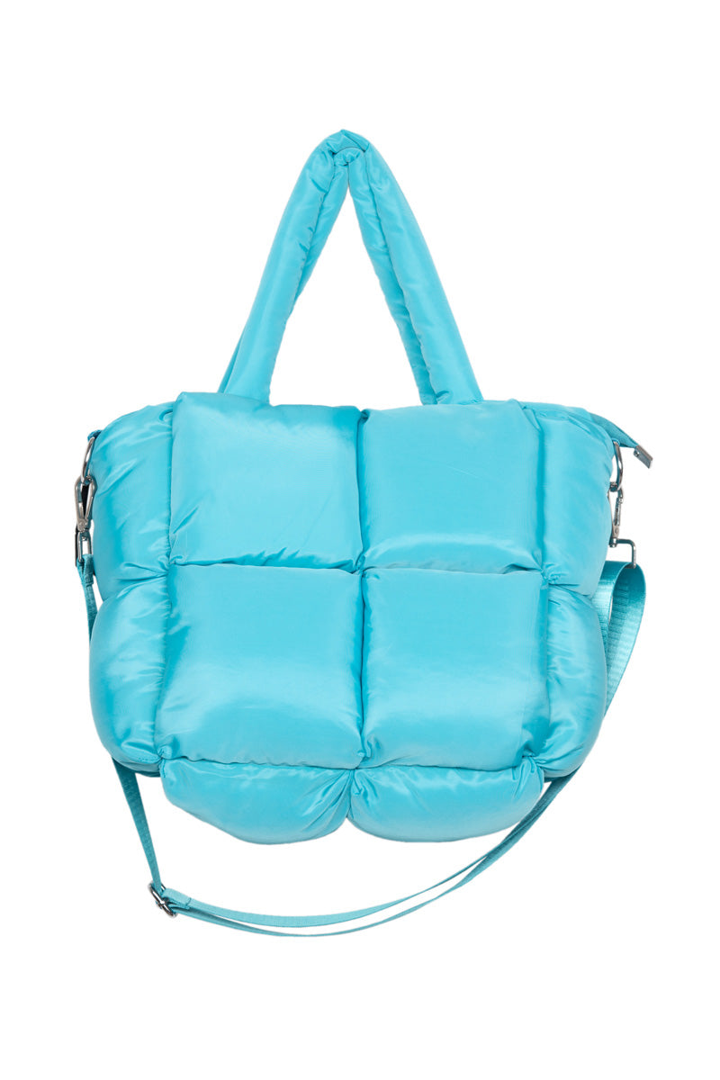 A puffy, quilted turquoise handbag with two short handles and a detachable shoulder strap, displayed against a white background—perfect for pairing with cute accessories or cozy slippers from the Build Your Own Katydid Set by Katydid.com 10 items for 60, a 350 value.