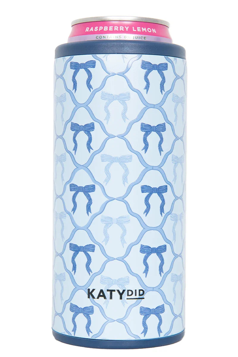 The Blue Coquette Bows Slim Can Insulator by Katydid features a blue bow pattern on light blue, a pink top labeled Raspberry Lemon, and the Katydid brand name in black near the bottom.