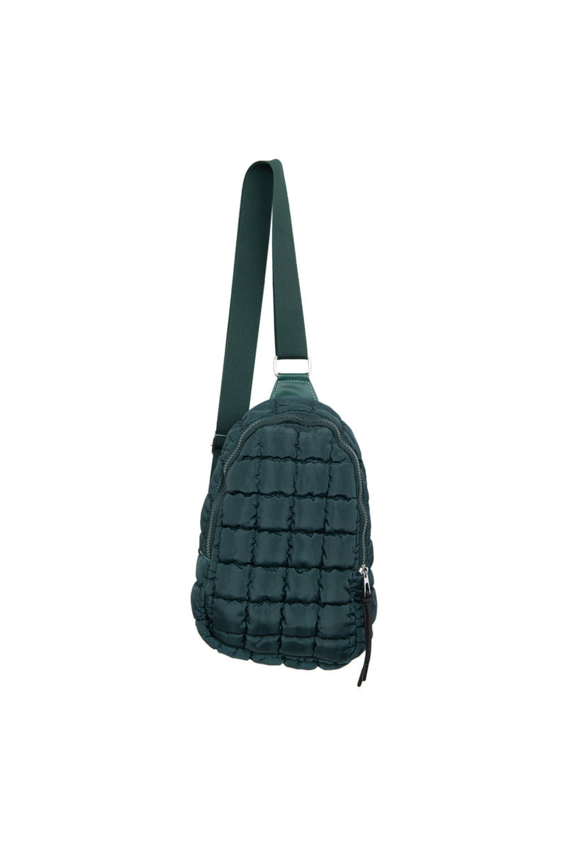 The Katydid Forest Green Quilted Sling Bag features a padded texture and adjustable strap, shown against a white background—a modern, casual style perfect for fans of quilted sling bags in rich fall colors.