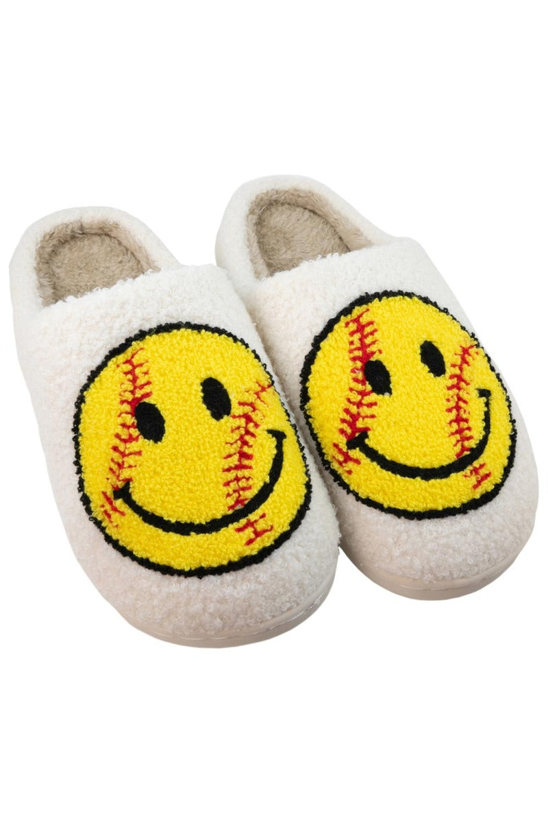 The Katydid Softball Happy Face Fuzzy Slippers feature white fuzzy material with yellow smiley faces and red softball stitching—perfect for any softball fan or as a unique gift for your softball-loving friends.