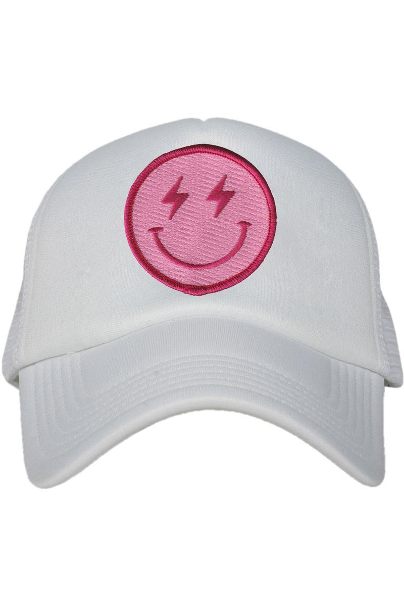 The Katydid Hot Pink Lightning Happy Face Foam Trucker Hat features a pink smiley face with lightning bolt eyes on the front and a breathable mesh back.
