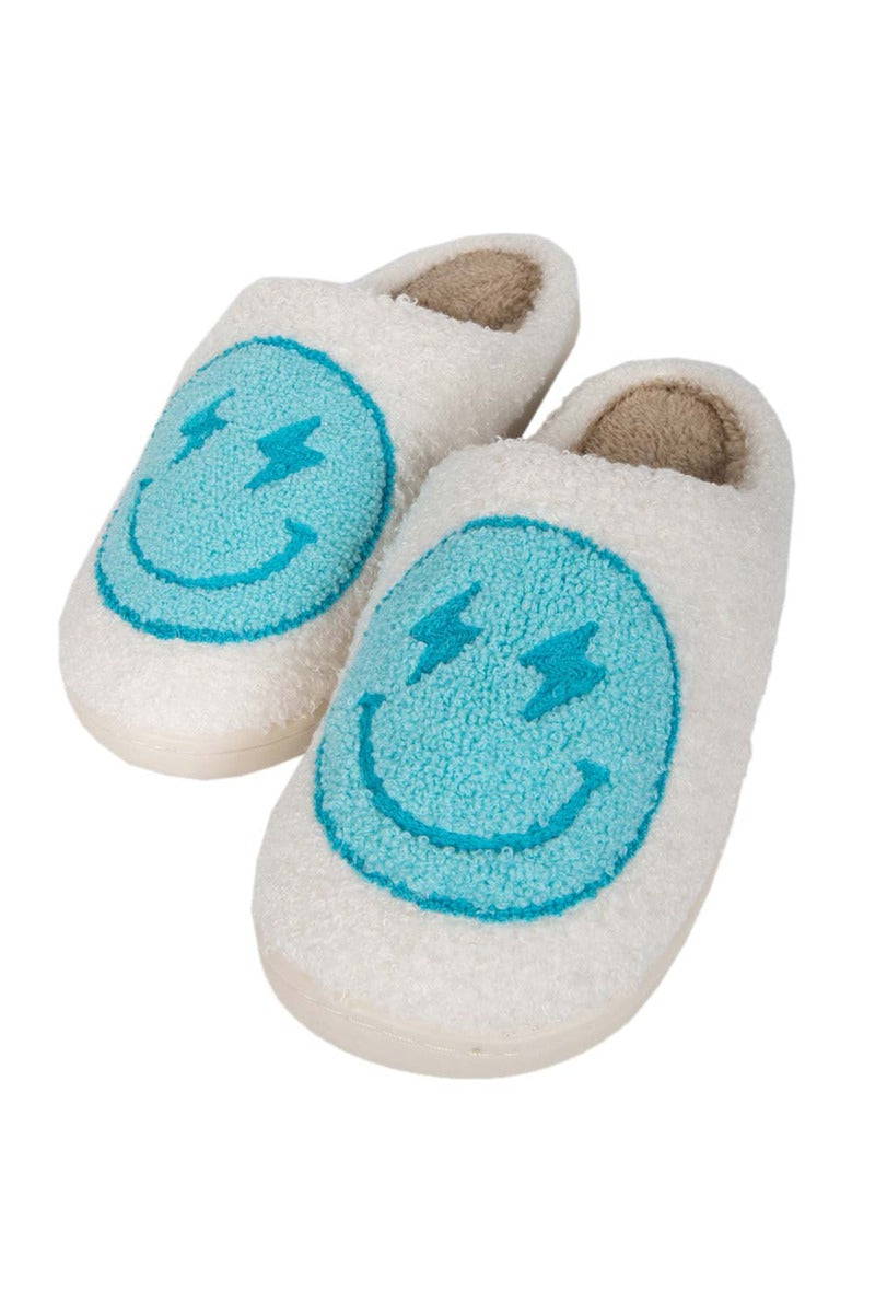 Slip on the Katydid Turquoise and White Lightning Happy Slippers, featuring smiley faces with lightning bolt eyes. For best results, hand wash warm and hang to dry. See our size chart for your perfect fit.